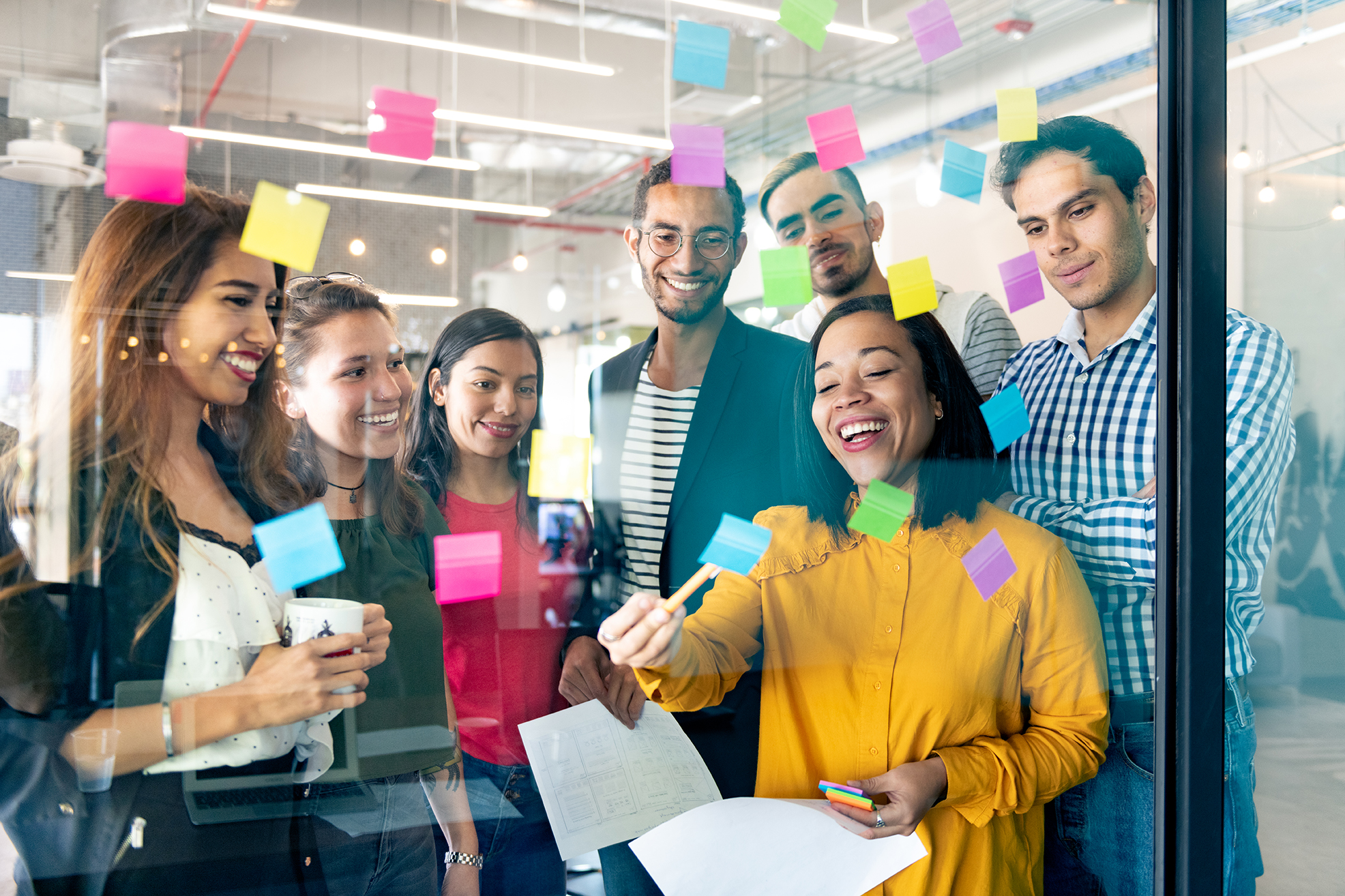 people working with post it notes Blog